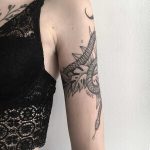 Snake and leaves tattoo on the arm
