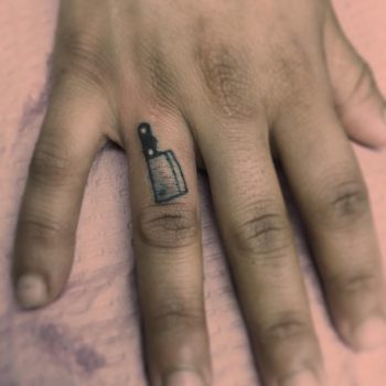 Tiny chef's knife tattoo by Jen Wong