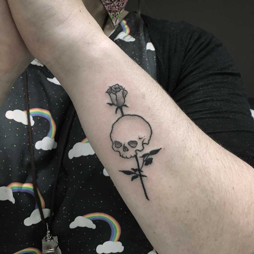 Tiny rose and skull tattoo