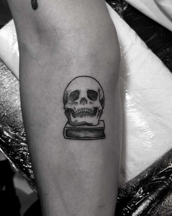 Tiny skull on a book