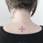 Tiny tattoo on the back by Angie Noir