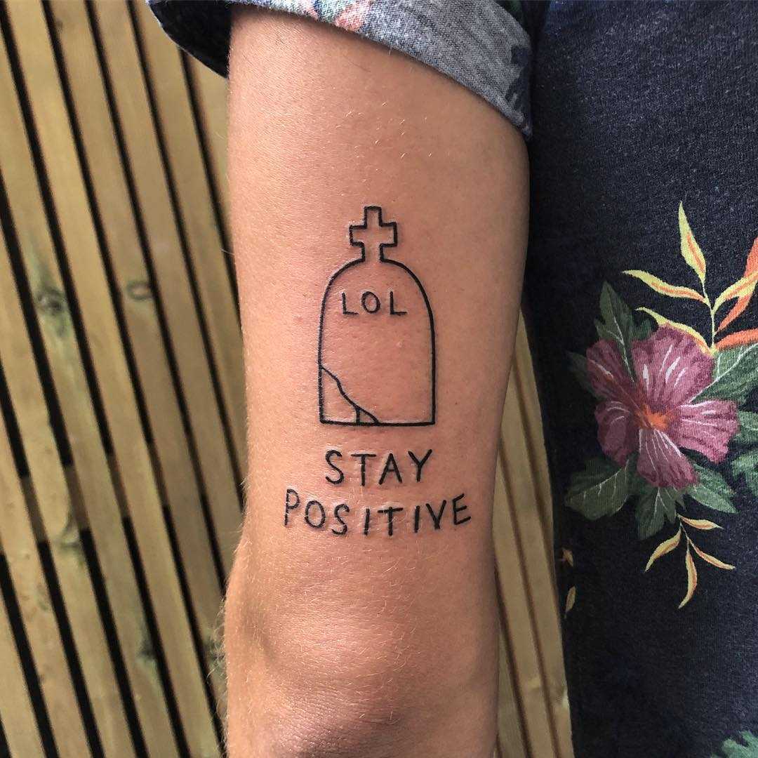 Tombstone and quote tattoo