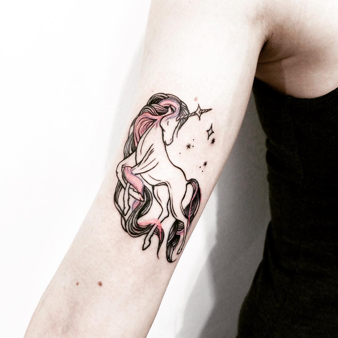 Unicorn tattoo on the right arm