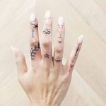 Various finger tattoos by artist Cholo