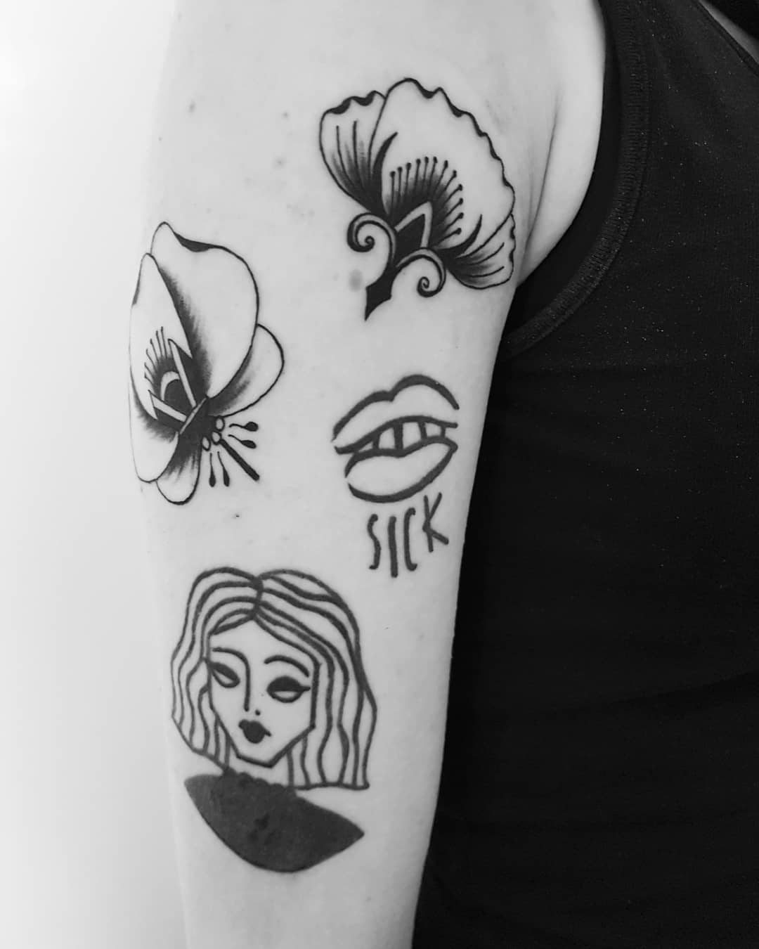 Various tattoos on the right arm