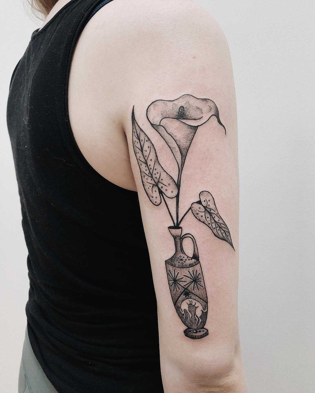 Vase with flowers tattoo on the arm
