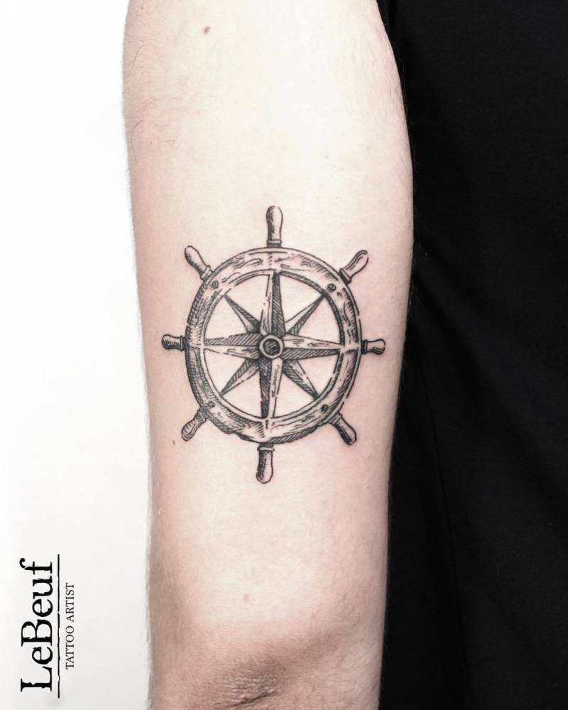Wheel of ship tattoo by Loïc Lebeuf
