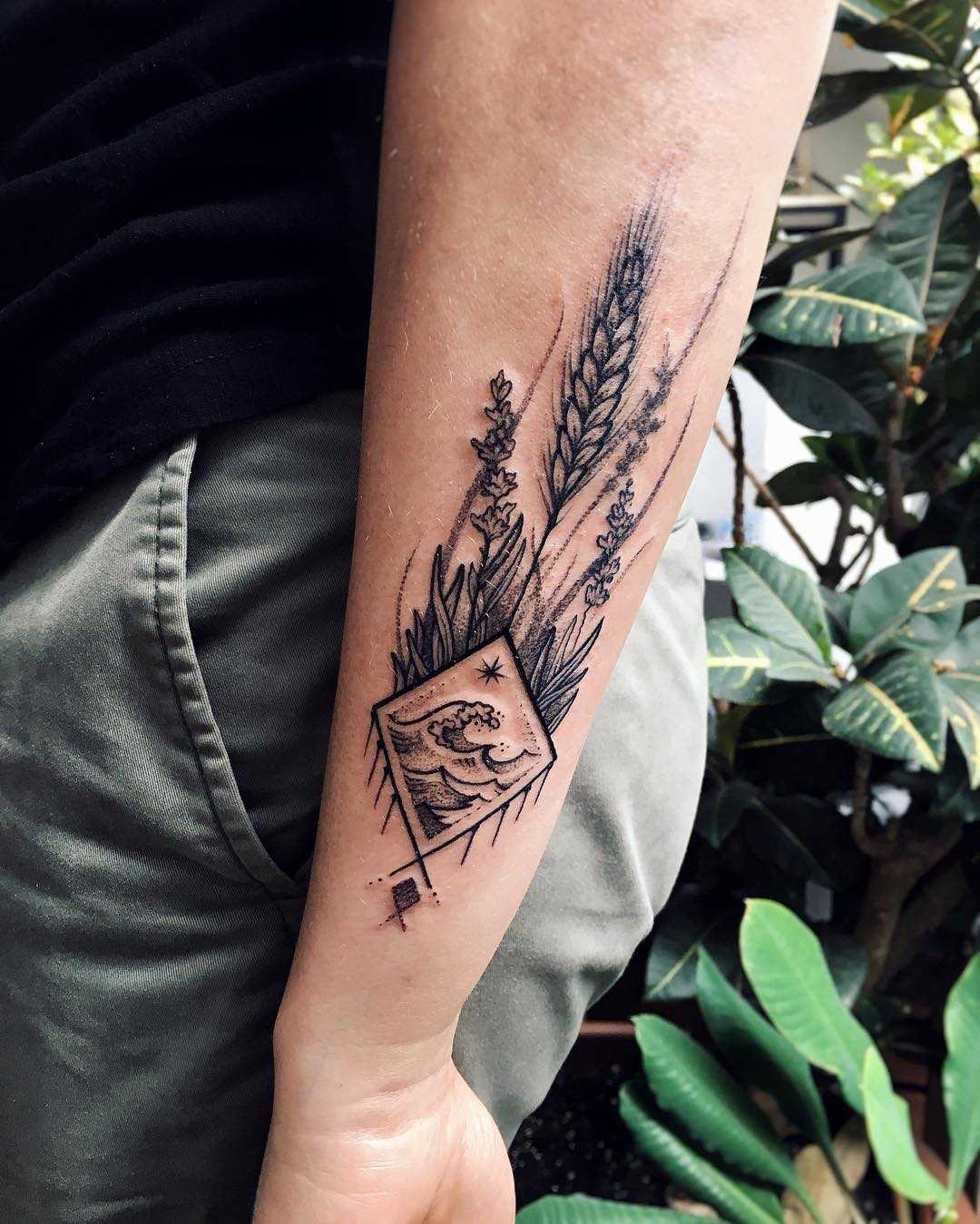 Wildflowers and rhombus landscape tattoo