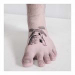 Windmill tattoo on the foot