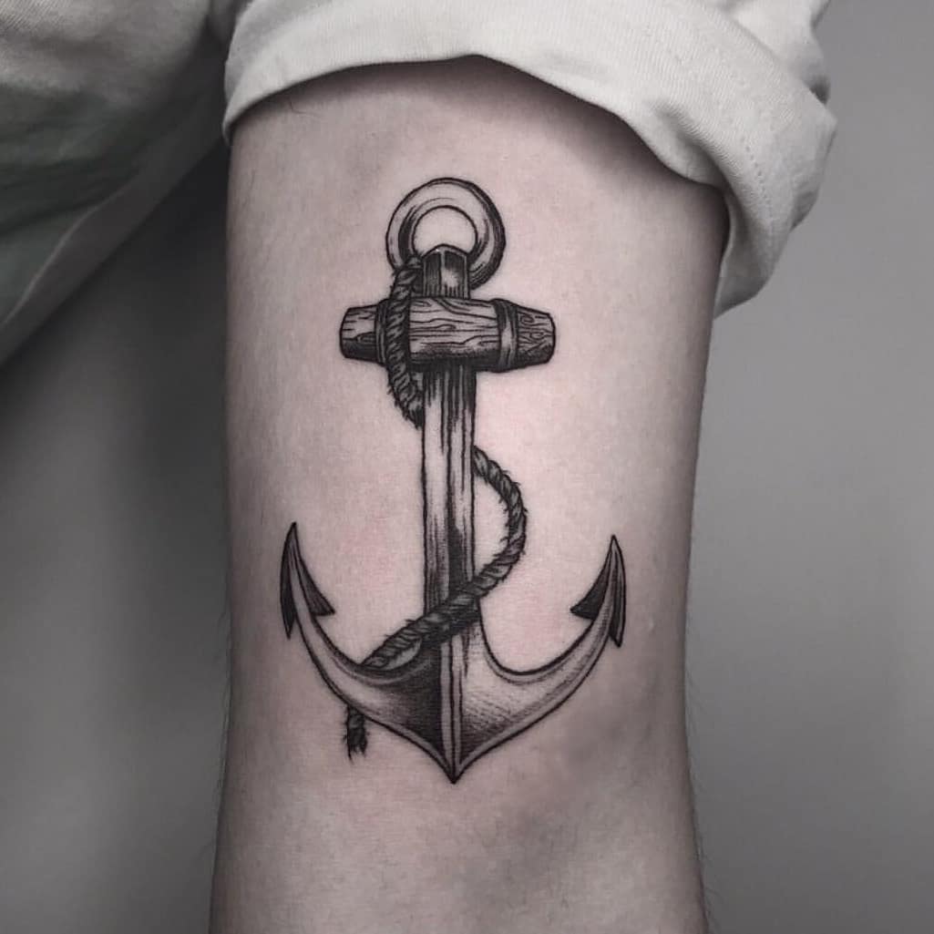 Woodcut anchor tattoo on the bicep