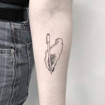Writer's hand tattoo