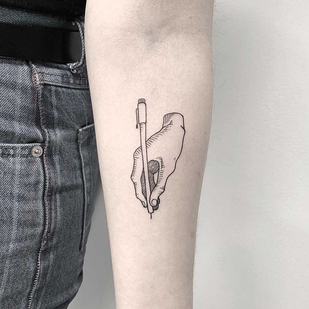Writer’s hand tattoo