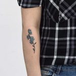 A small forget me not tattoo