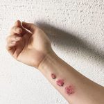 Aesthetic rose tattoo on the wrist