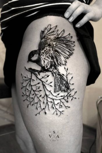 Bird on a branch tattoo by Andrei Svetov