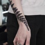 Black and grey fern tattoo