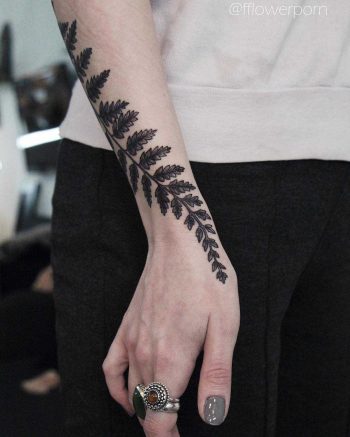 Black and grey fern tattoo
