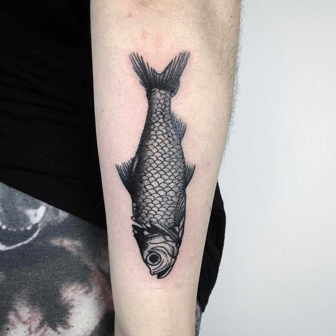Black and grey fish tattoo by Unkle Gregory