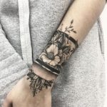 Black and grey floral armband tattoo