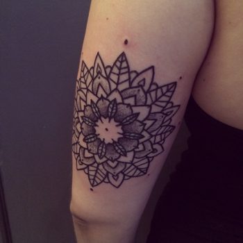 Black and grey ornamental mandala tattoo