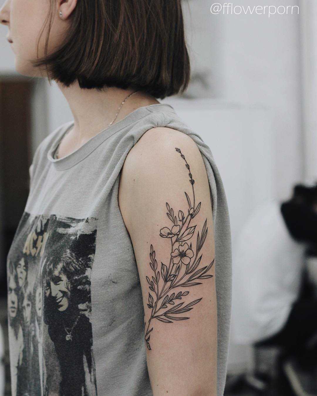 Black and grey wild flowers tattoo