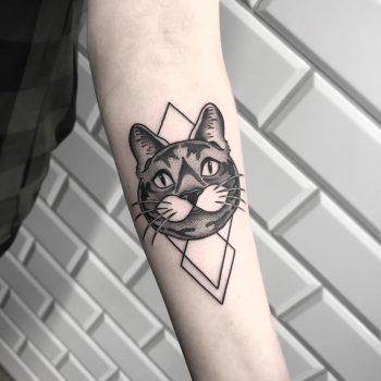 Black cat and rhombus tattoo