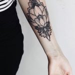 Black flower tattoo by Anna Enola