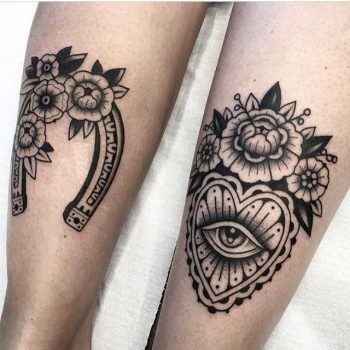 Black tattoos on calves by Arianna Fusini