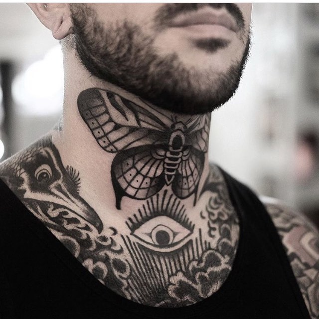 Butterfly tattoo on the neck by Jonas Ribeiro