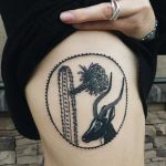 Cactus and antelope tattoo