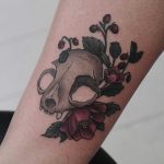 Cat skull with asian poppies and wild strawberries tattoo