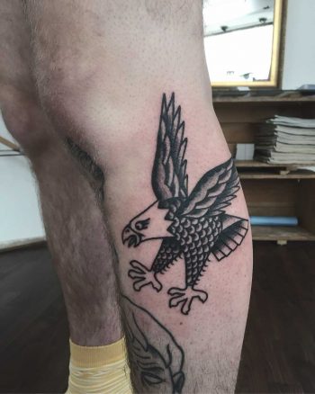 Comic book style hawk tattoo