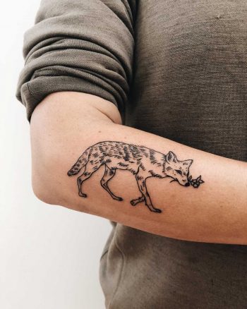 Cute fox tattoo on the forearm