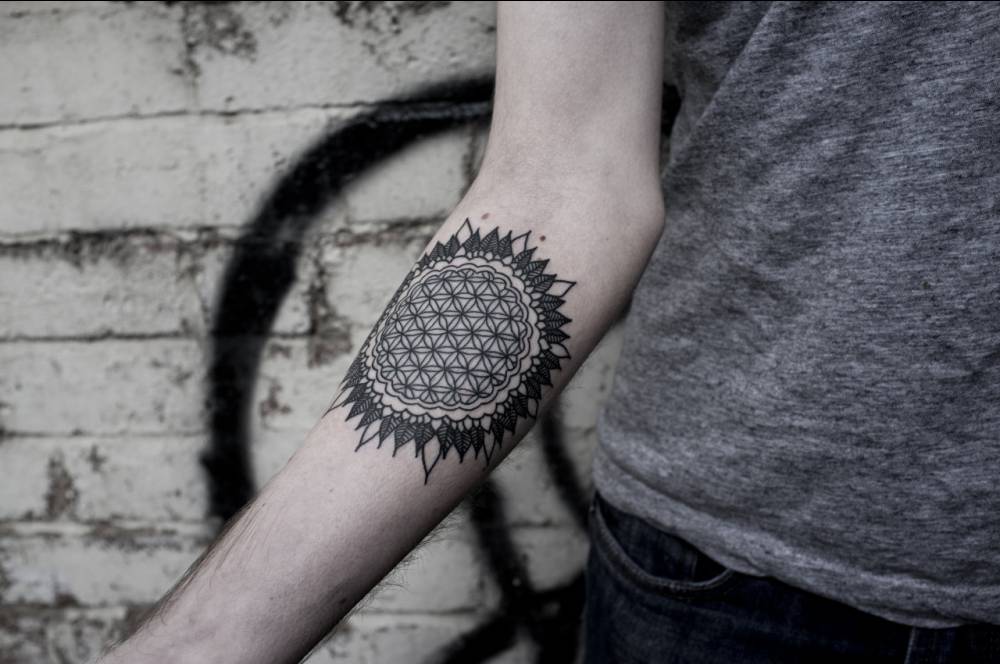Flower of life on the right forearm