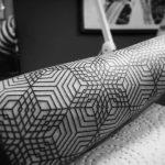 Geometric pattern arm tattoo