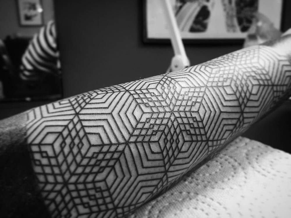 Geometric pattern arm tattoo 