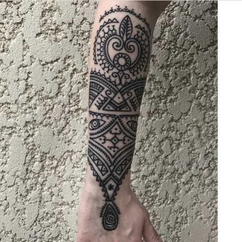 Gorgeous forearm piece by Sentenza Tattoos