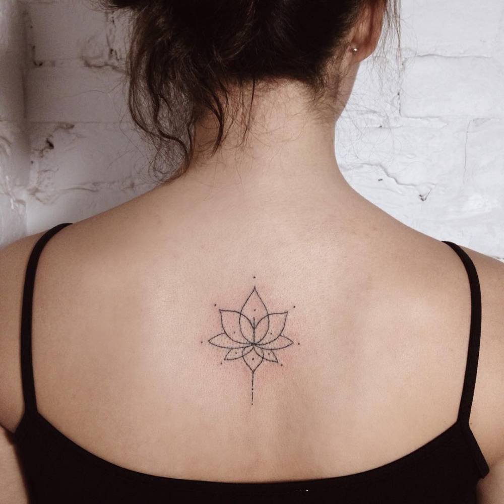 Hand-poked Lotus flower tattoo on the back 