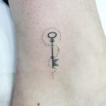 Hand-poked key tattoo