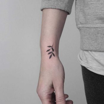 Hand-poked tiny sprig by Lara M J