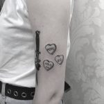 Hearts and knife tattoo