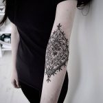 Inner elbow ornamental tattoo