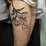 Lillies tattoo on the thigh
