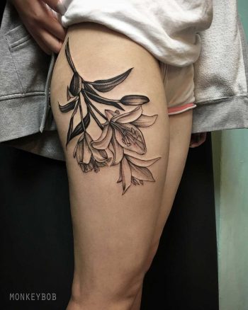 Lillies tattoo on the thigh