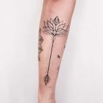 Lotus arrow tattoo by Dogma Noir