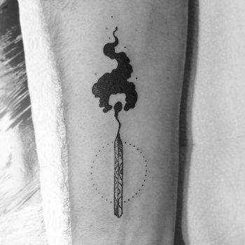 Match tattoo on the inner forearm