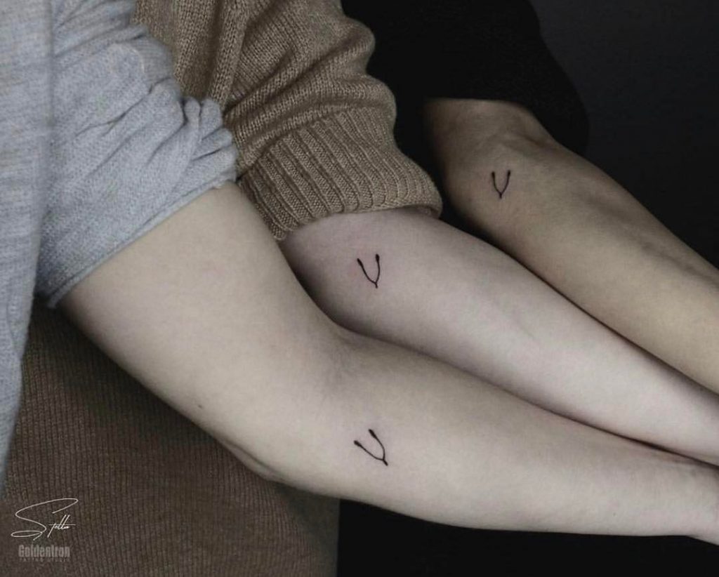 Matching wishbone tattoos by Stella Tx