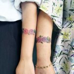 Mother and daughter flower tattoos