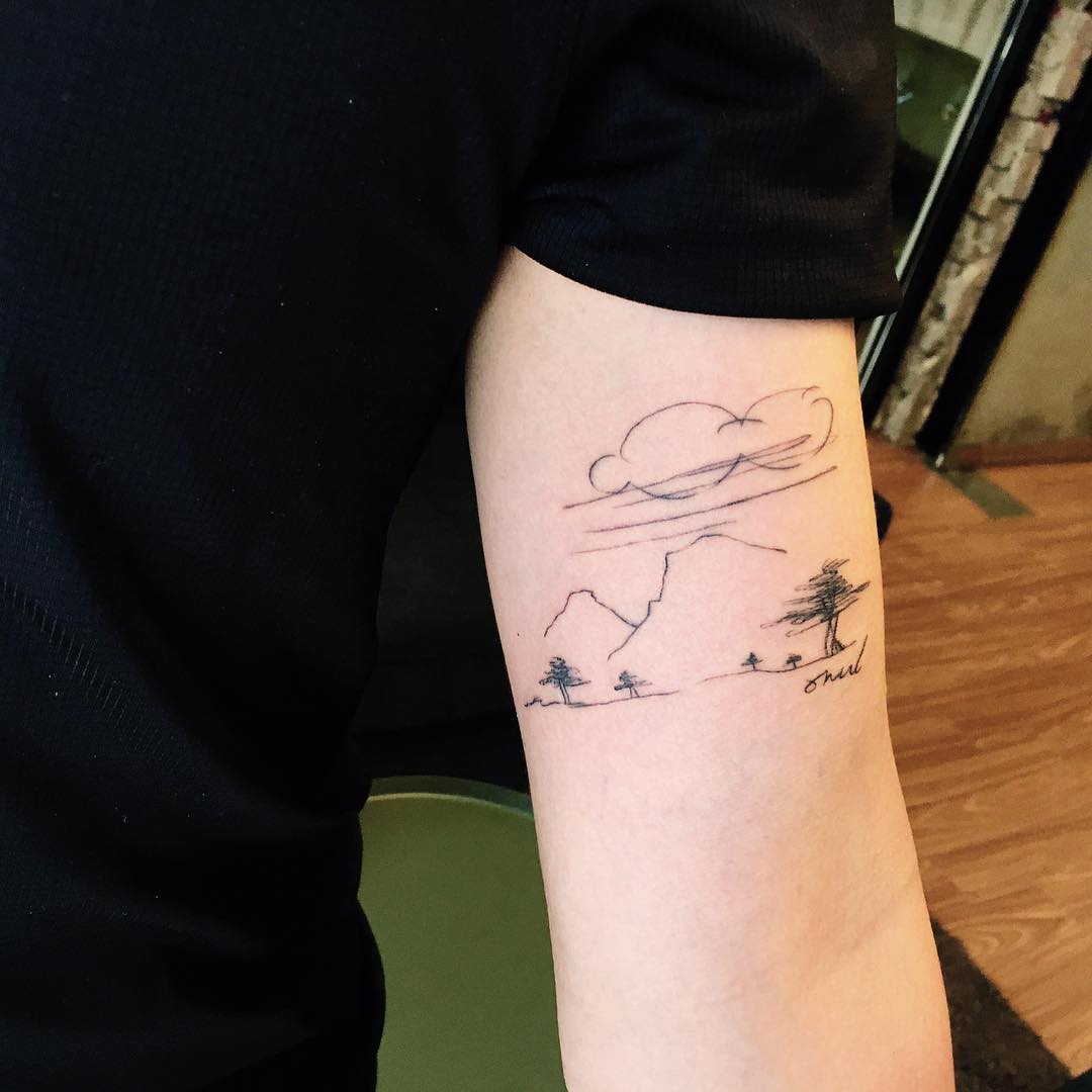 Mountains and clouds tattoo