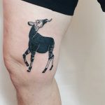 Okapi tattoo on the thigh